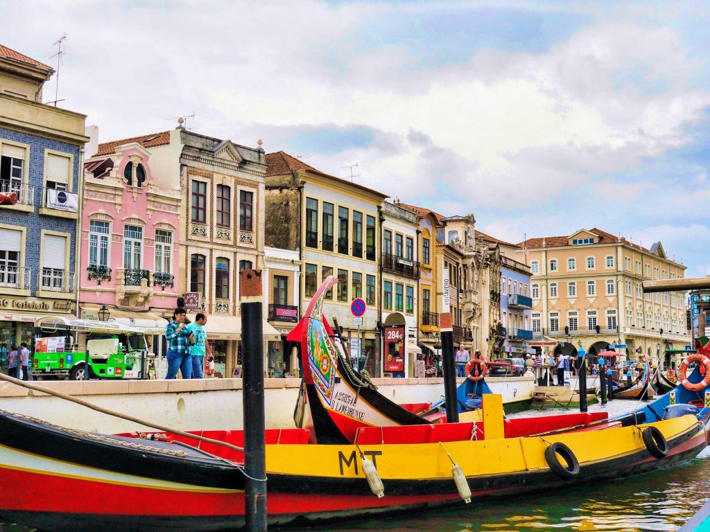 The main canal of Aveiro with some Moliceiros or traditional boats, Portugal