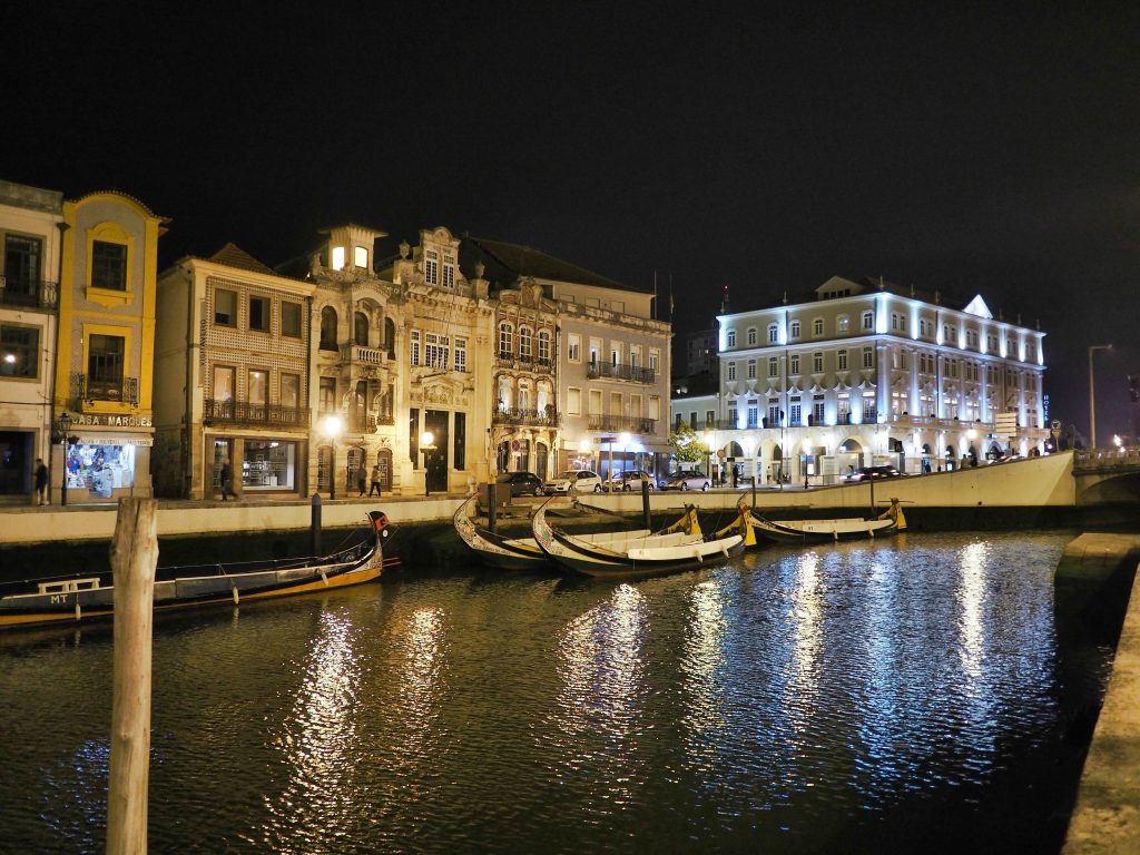 Night view of the main canal of Aveiro with some Moliceiros or traditional boats, Portugal