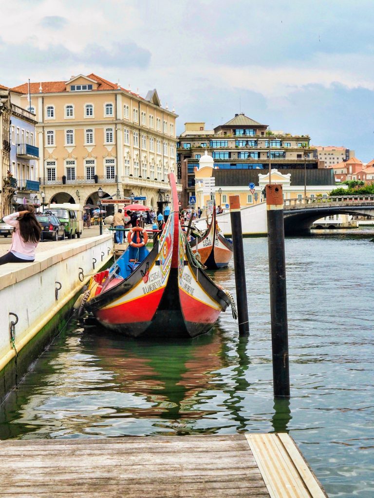 The main canal of Aveiro with a Moliceiro or traditional boat, Portugal