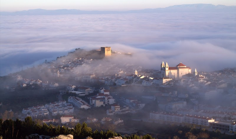 A view from far to Castelo de Vide small town on a misty and cloudy day
