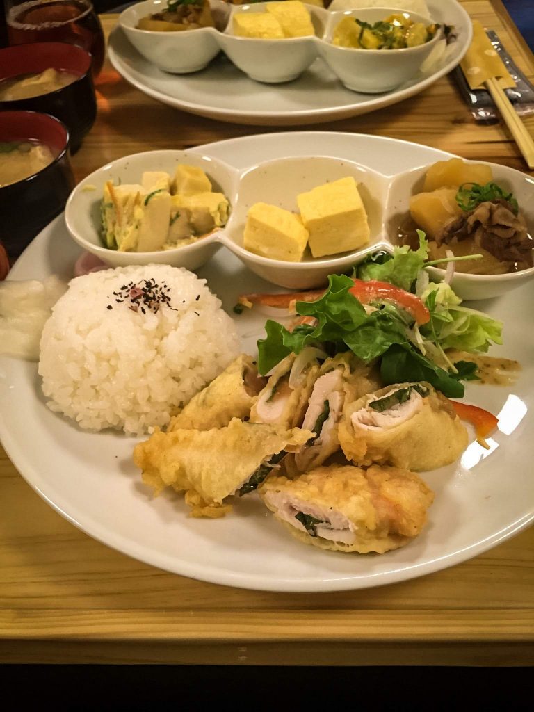 miso soup, a ginormous plate of rice, chicken tempura, green salad, boiled eggs 