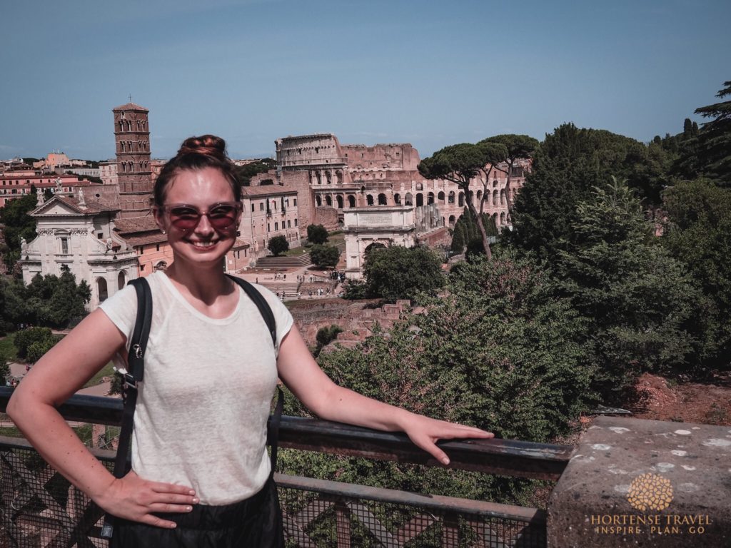 A girl overlooking the Colosseum in Monti, Rome